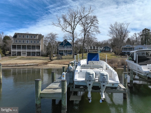 dock area with a water view and boat lift