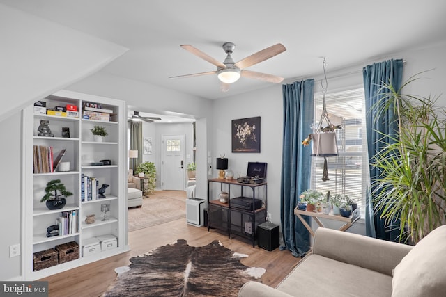 interior space with light wood-style floors and a ceiling fan