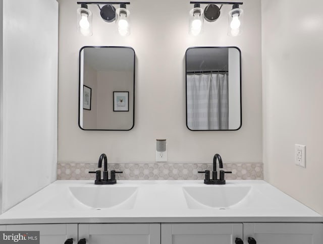 bathroom featuring double vanity and a sink