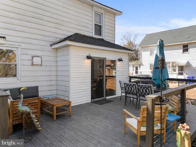 deck with outdoor dining space