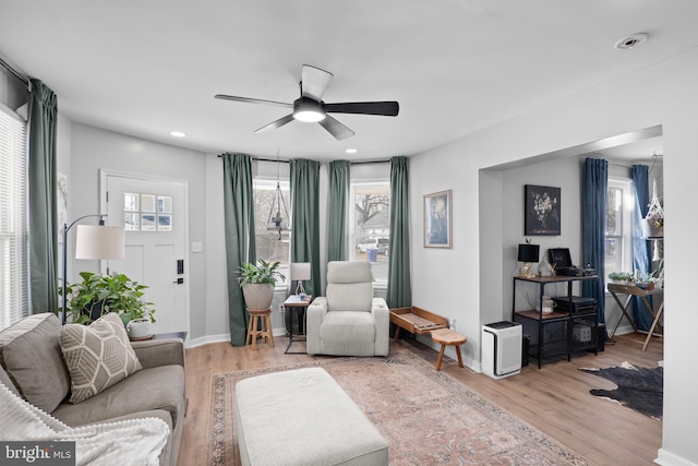 living area featuring recessed lighting, light wood-style flooring, baseboards, and ceiling fan