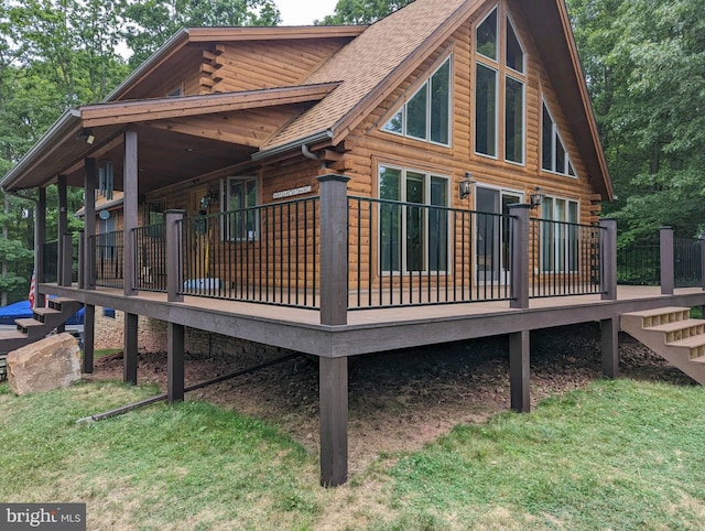 view of property exterior with log siding, stairs, and a shingled roof