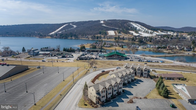 aerial view featuring a water and mountain view