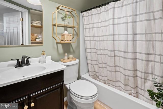 bathroom with vanity, toilet, and shower / tub combo with curtain