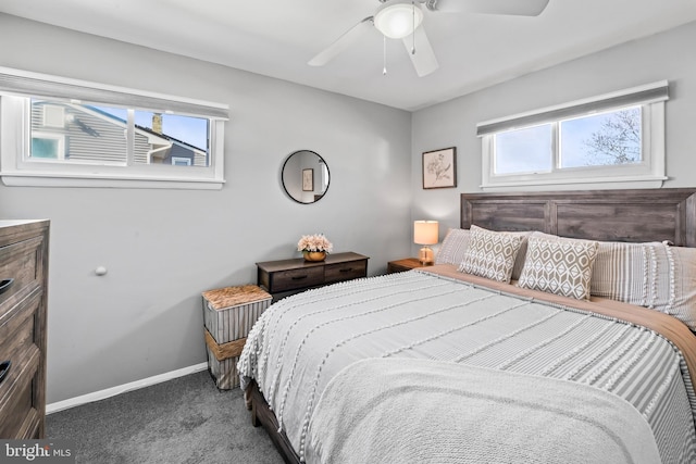 carpeted bedroom featuring baseboards and ceiling fan