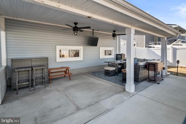 view of patio / terrace featuring ceiling fan, outdoor lounge area, and fence