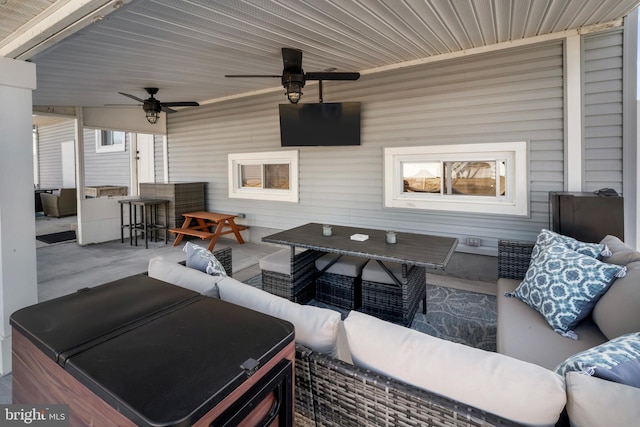 view of patio / terrace featuring outdoor dining space, an outdoor living space, and ceiling fan