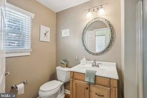 bathroom with toilet and vanity