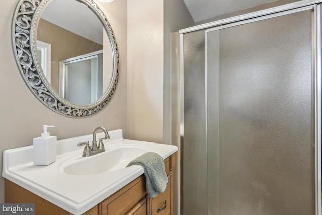 full bath featuring vanity and a stall shower