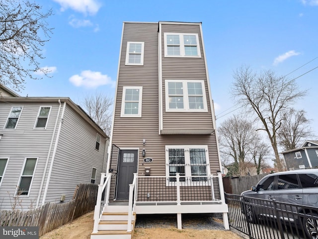 view of front of home with fence