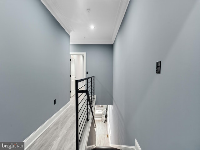 staircase with recessed lighting, baseboards, wood finished floors, and crown molding