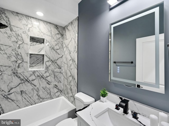 bathroom featuring recessed lighting, toilet, vanity, and washtub / shower combination