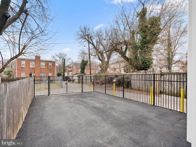 exterior space featuring fence and a residential view