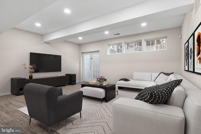 living room featuring visible vents, recessed lighting, baseboards, and wood finished floors