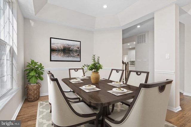 dining area with visible vents, recessed lighting, baseboards, and wood finished floors