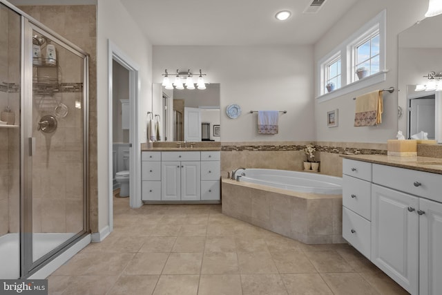 bathroom featuring visible vents, a bath, a shower stall, and tile patterned flooring