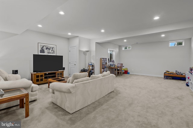 living room with recessed lighting, baseboards, and light carpet