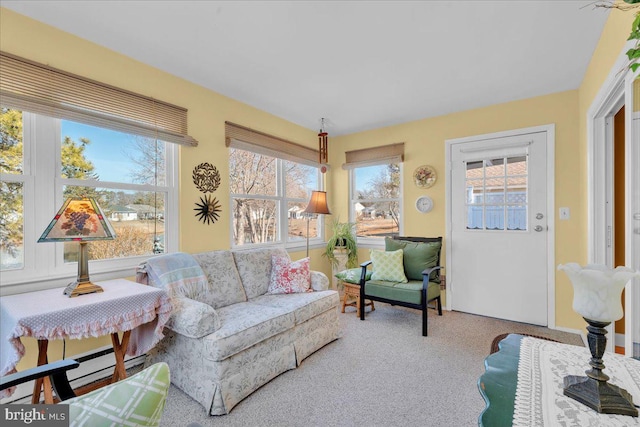 living room with carpet floors and baseboard heating