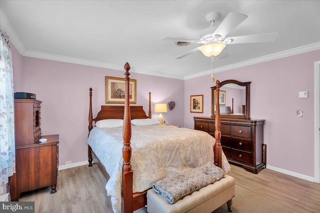 bedroom with baseboards, light wood-style flooring, and ornamental molding