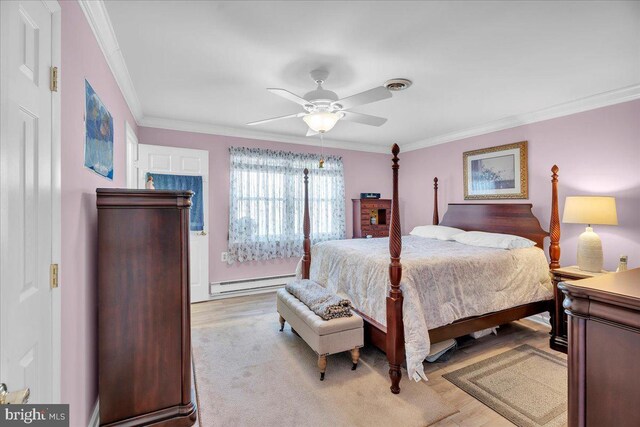 bedroom with visible vents, ornamental molding, baseboard heating, light wood-style floors, and a ceiling fan