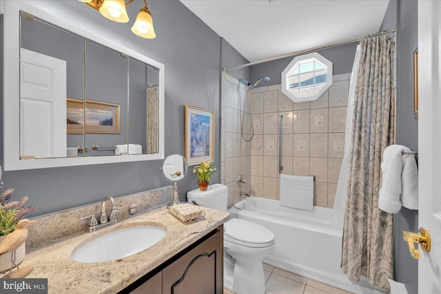 bathroom with vanity, tile patterned floors, toilet, and shower / bath combo