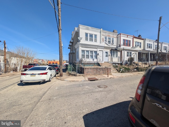 view of property featuring a residential view and a fenced front yard