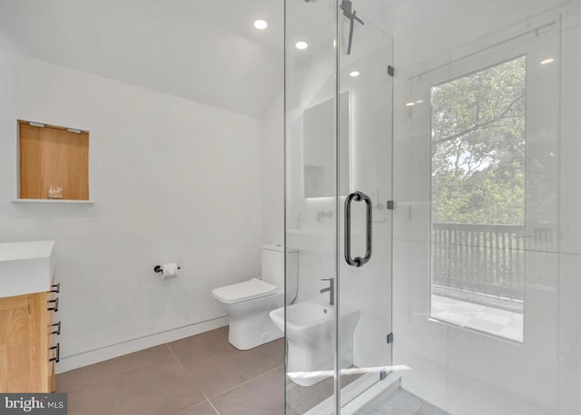 full bathroom featuring tile patterned floors, toilet, a stall shower, a bidet, and vanity