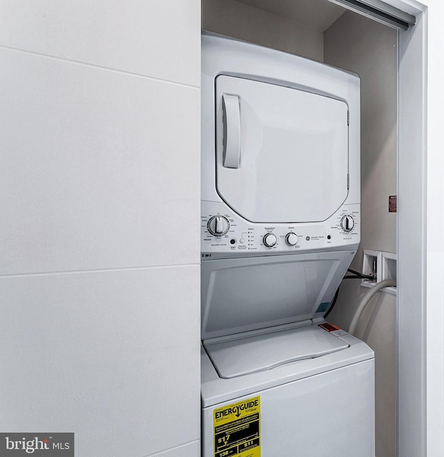 laundry area with laundry area and stacked washing maching and dryer