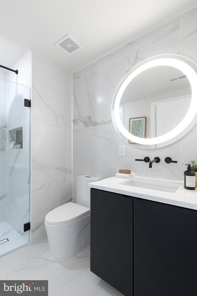 full bathroom with a marble finish shower, visible vents, toilet, marble finish floor, and vanity