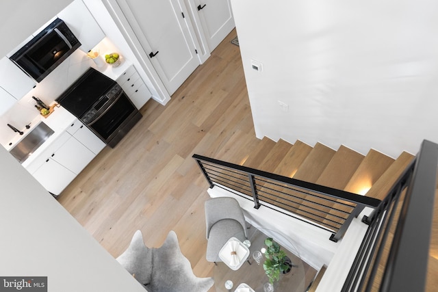 stairway with wood finished floors