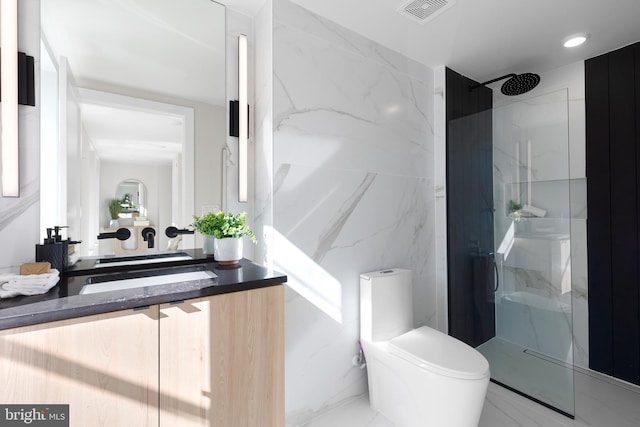 full bath featuring vanity, visible vents, a marble finish shower, toilet, and marble finish floor