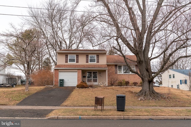 view of front facade featuring aphalt driveway, brick siding, an attached garage, and a shingled roof