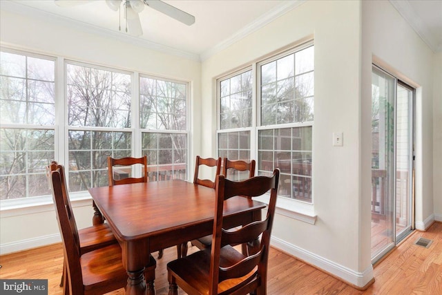 sunroom / solarium with visible vents and ceiling fan