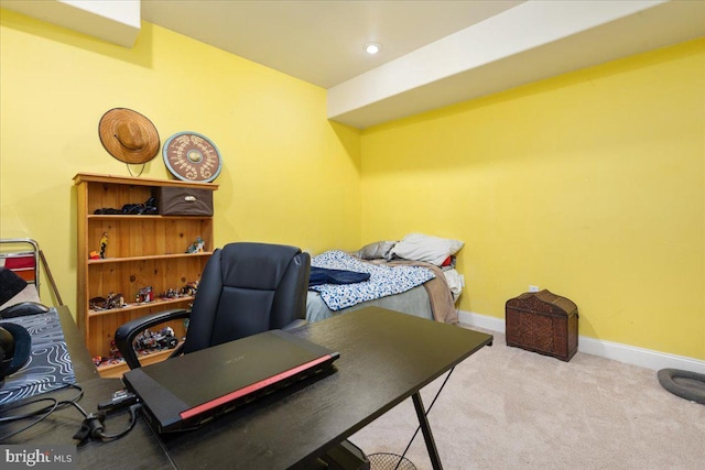 carpeted home office featuring baseboards