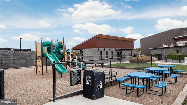 community jungle gym featuring fence