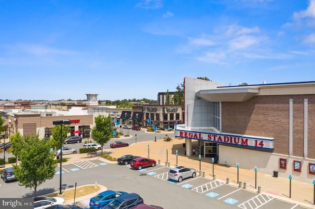 view of property featuring uncovered parking