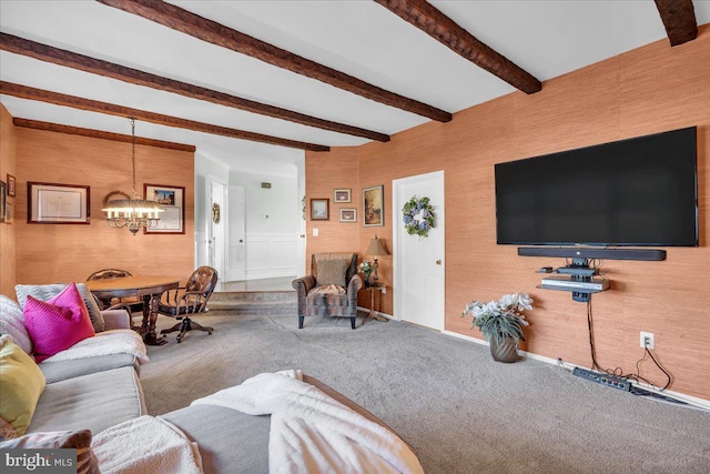 carpeted living room with beamed ceiling and an inviting chandelier