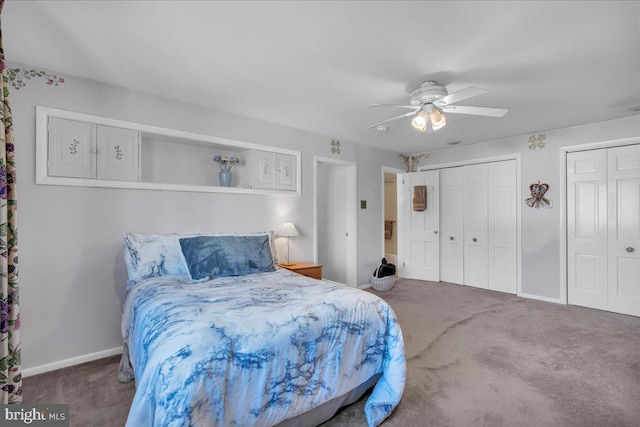 bedroom featuring a ceiling fan, carpet flooring, baseboards, and multiple closets