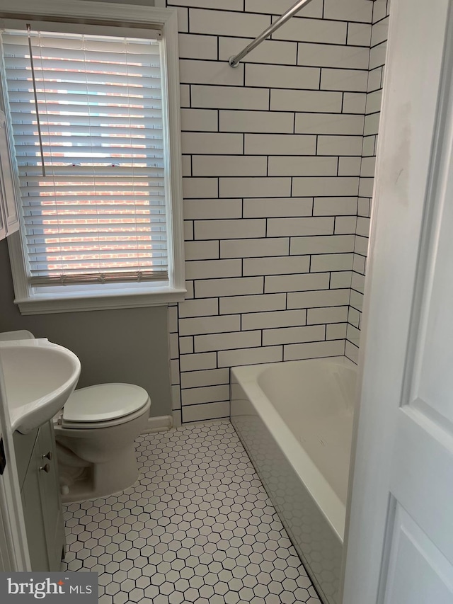 full bathroom with tile patterned floors, shower / bathing tub combination, toilet, and vanity