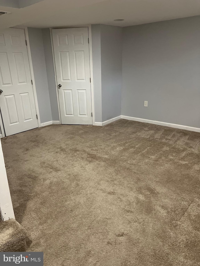 unfurnished bedroom with baseboards and carpet floors