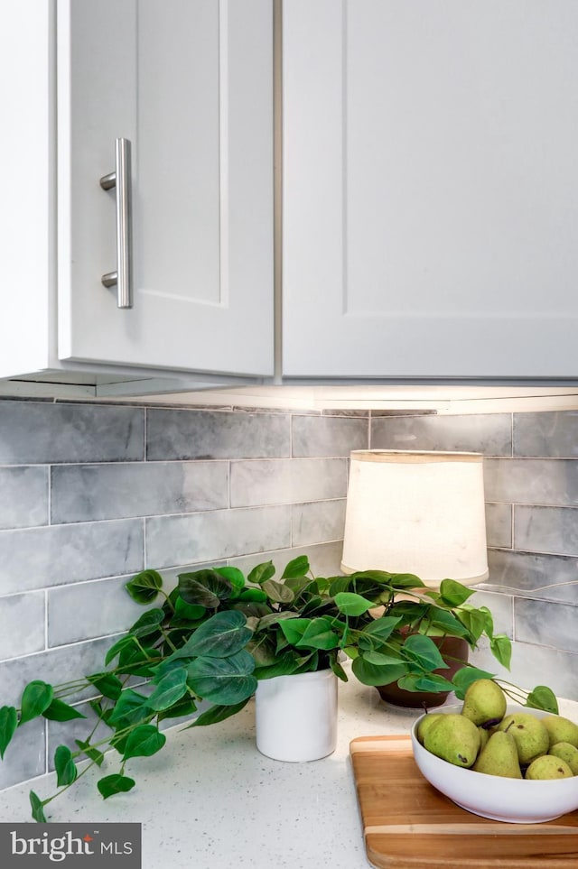 room details featuring light countertops and white cabinetry