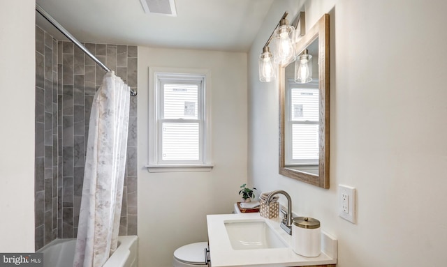 bathroom featuring visible vents, toilet, vanity, and shower / bath combination with curtain