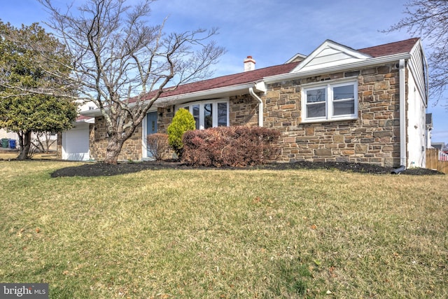 ranch-style home with stone siding, a chimney, and a front lawn