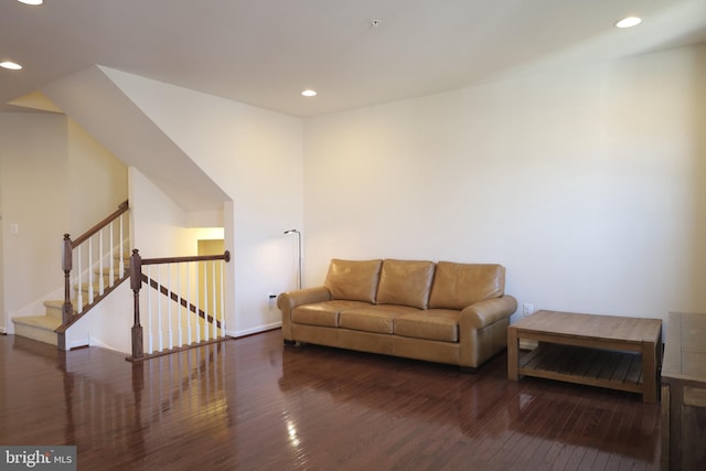 living room with stairs, recessed lighting, and wood-type flooring