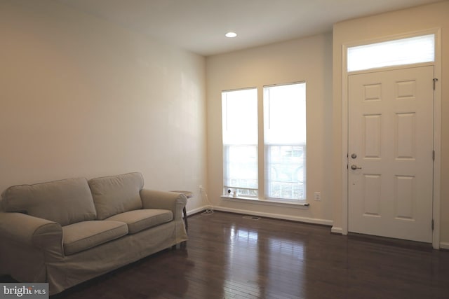 entrance foyer with recessed lighting, baseboards, plenty of natural light, and dark wood-type flooring