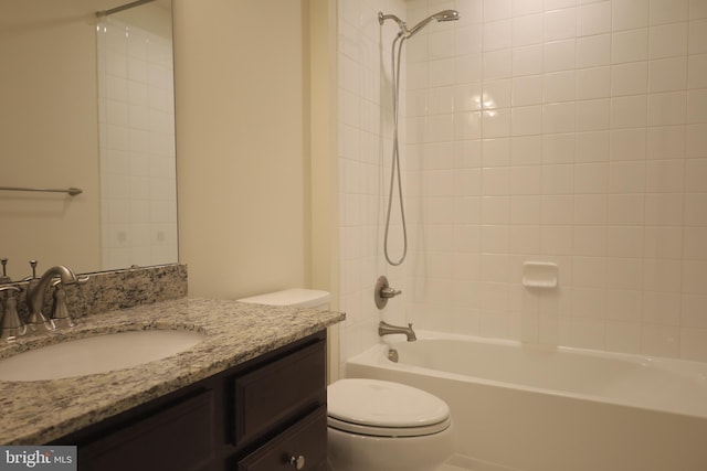 bathroom featuring vanity, toilet, and shower / bathtub combination