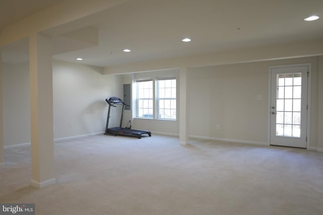 exercise room with recessed lighting, baseboards, and light colored carpet