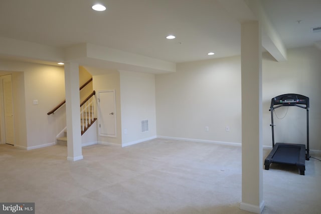 workout area featuring baseboards, recessed lighting, visible vents, and light carpet