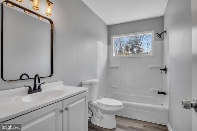 full bathroom featuring vanity, shower / bathing tub combination, toilet, and wood finished floors