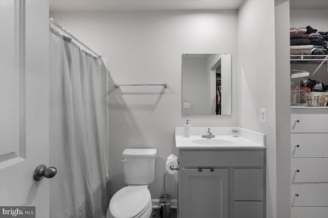 bathroom with toilet and vanity